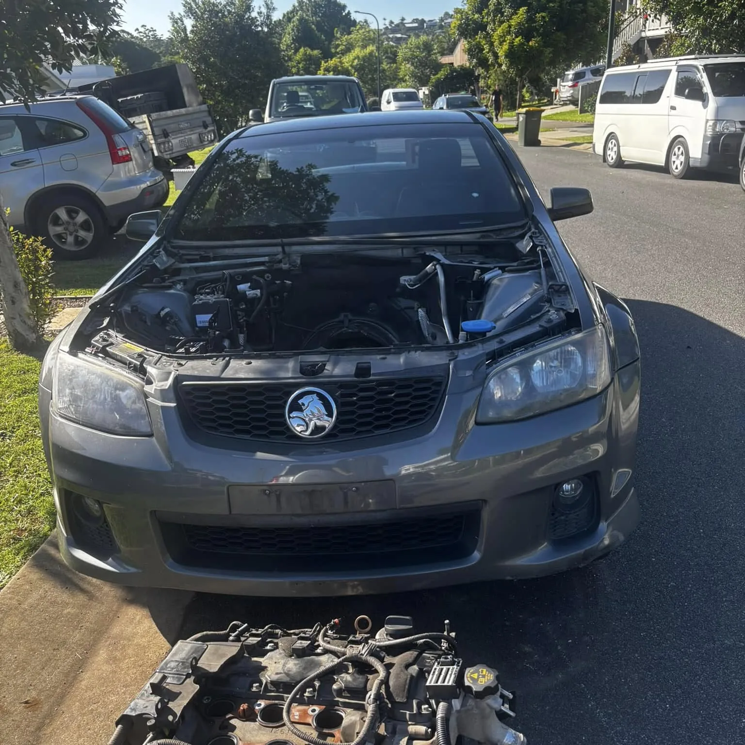 Holden Commodore with the engine removed, kerbside