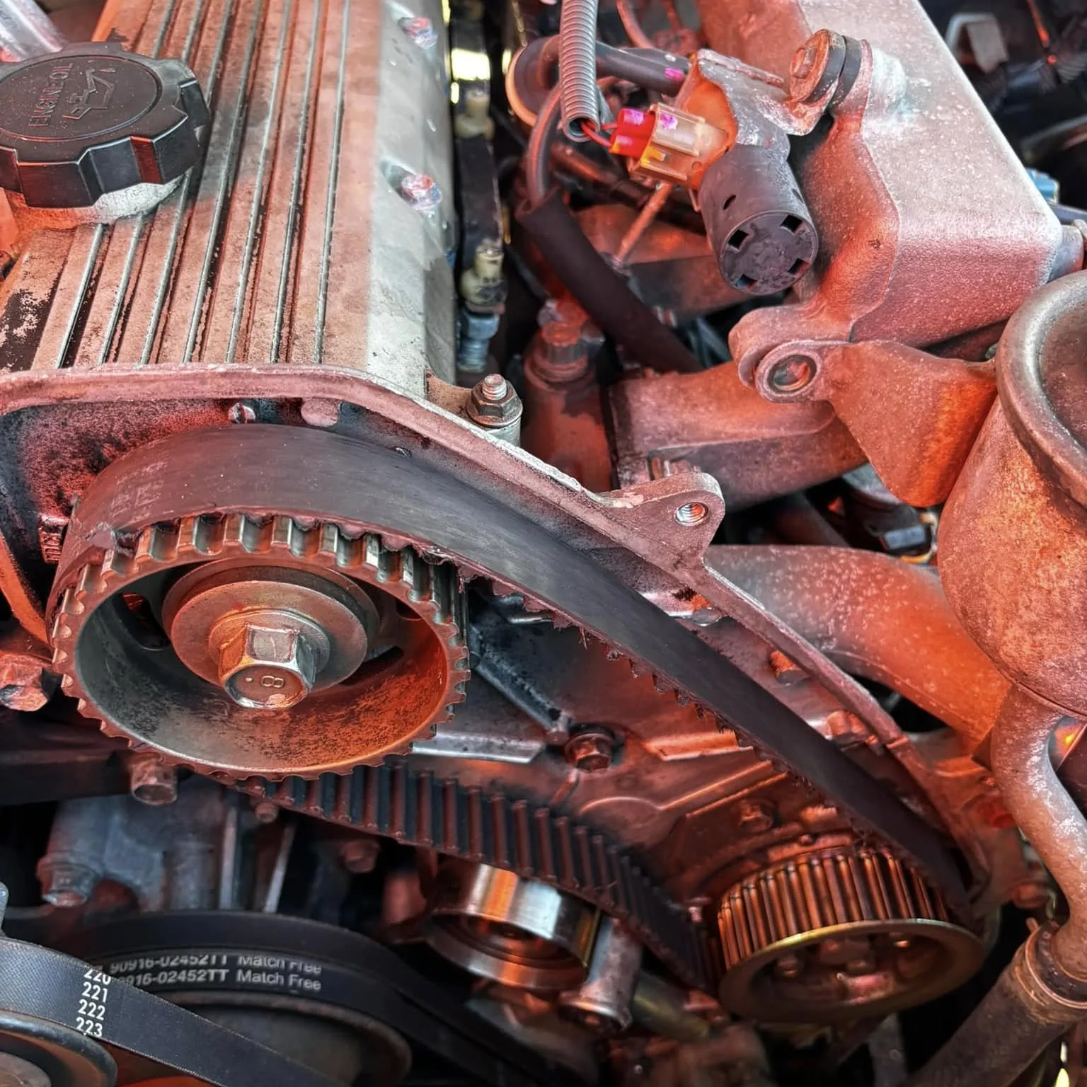 Subaru boxer engine with the timing belt and pulleys exposed